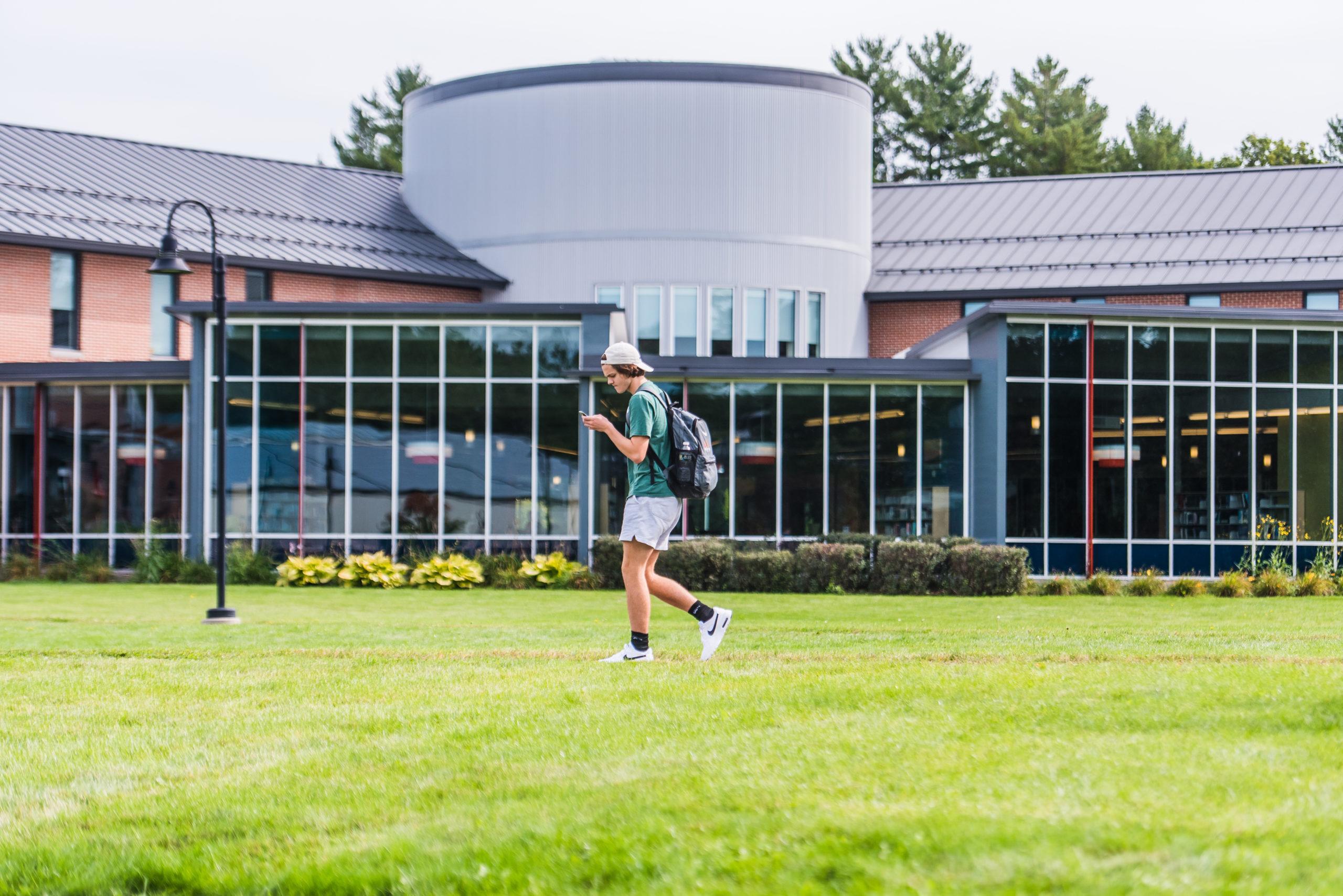 Student walking across campus